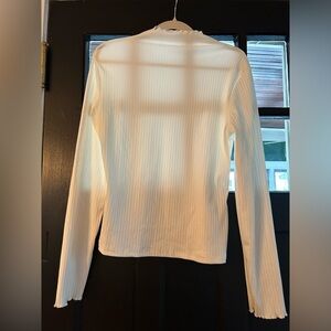 White ruffled turtleneck